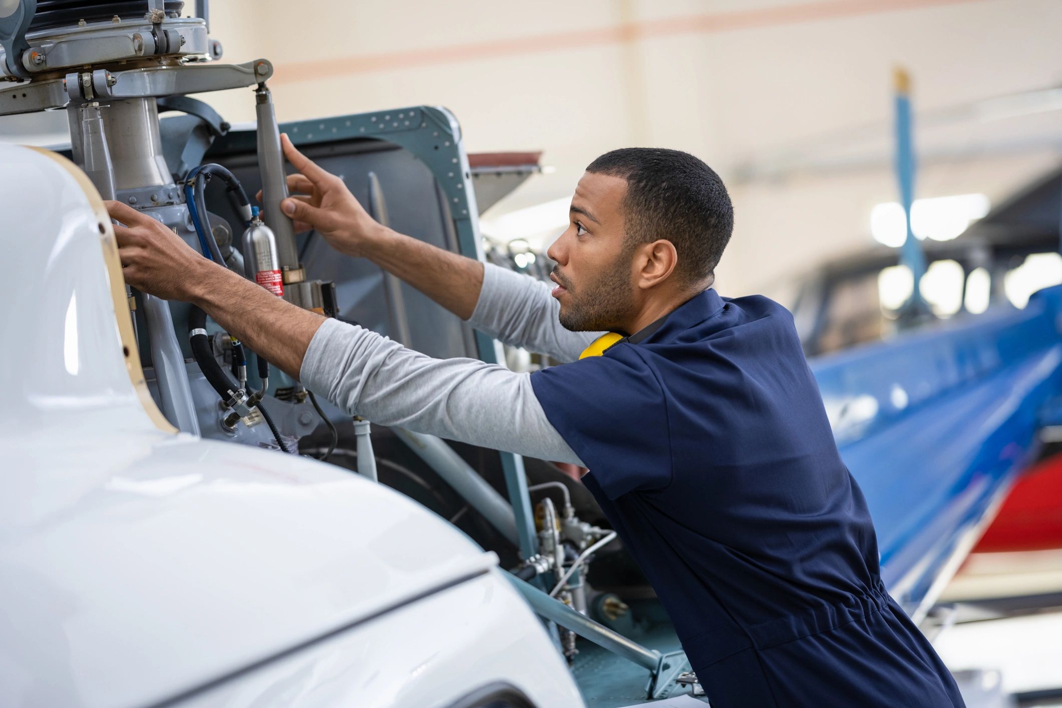 Aviation professional working in hangar