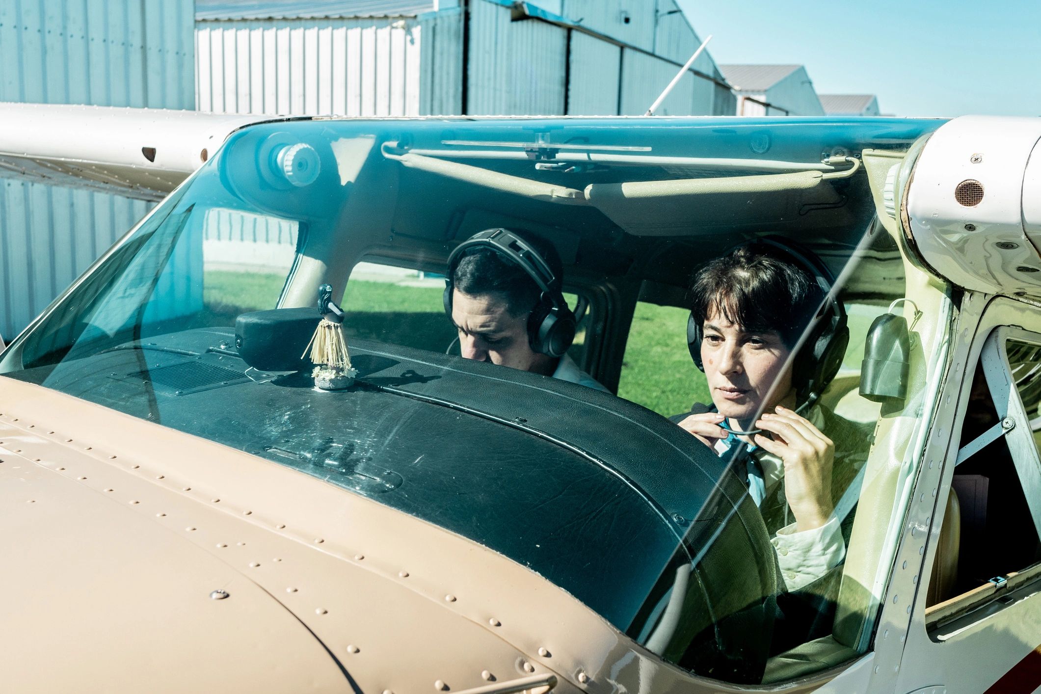 Instructor and student in a training aircraft cockpit