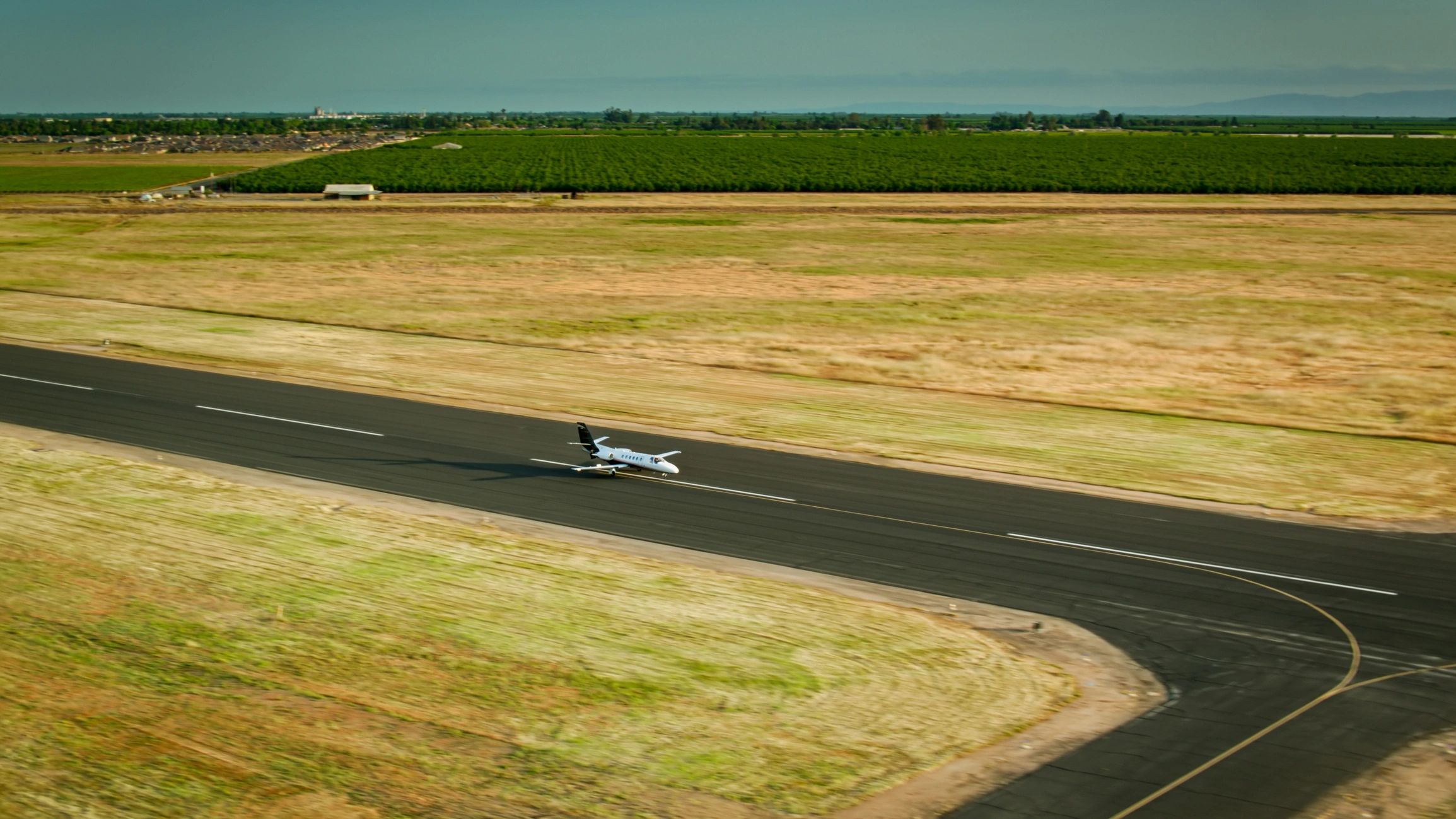 Plane arriving on private airfield and landing strip